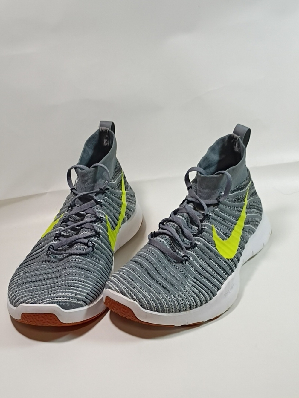 Nike Menโs Grey Flyknit Athletic Shoes with Neon Yellow Swoosh Size 10